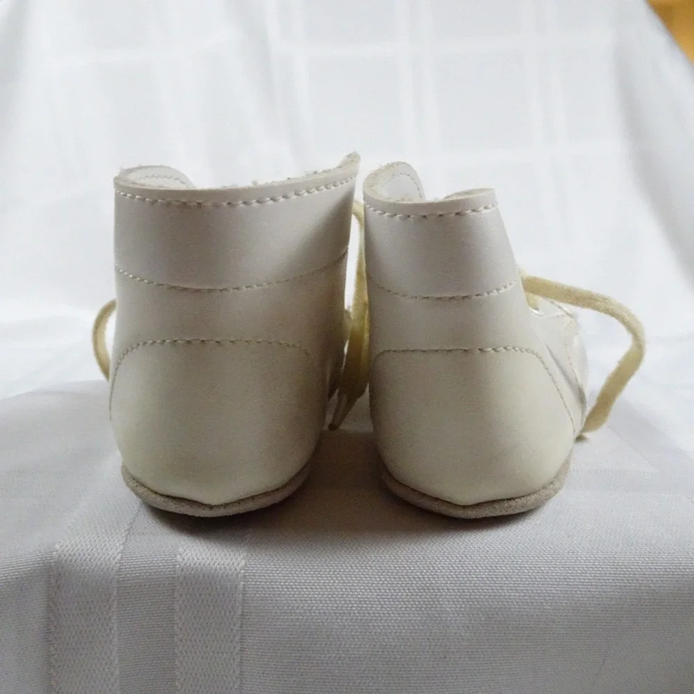 2 Sets Of Vintage Infant shoes. White pair and a Gray/Red pair.